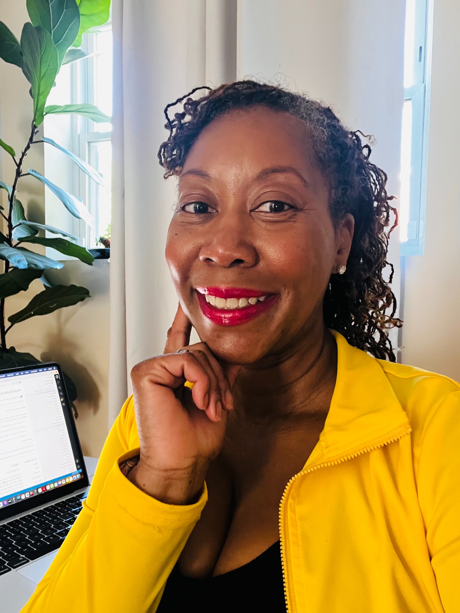 Tomeka Gueory working from her home office